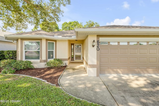 620 Middlebury Loop, New Smyrna Beach, FL 32168 - ranch-style house with stucco siding, driveway, an attached garage, and a shingled roof