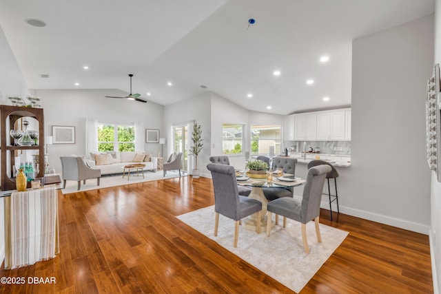620 Middlebury Loop, New Smyrna Beach, FL 32168 - dining space with lofted ceiling, wood finished floors, ceiling fan, and recessed lighting