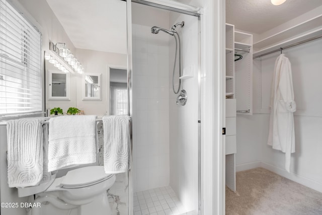 620 Middlebury Loop, New Smyrna Beach, FL 32168 - bathroom with a shower stall, healthy amount of natural light, and a spacious closet