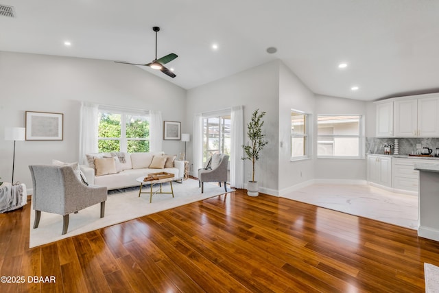 620 Middlebury Loop, New Smyrna Beach, FL 32168 - living room featuring wood finished floors, vaulted ceiling, ceiling fan, and recessed lighting