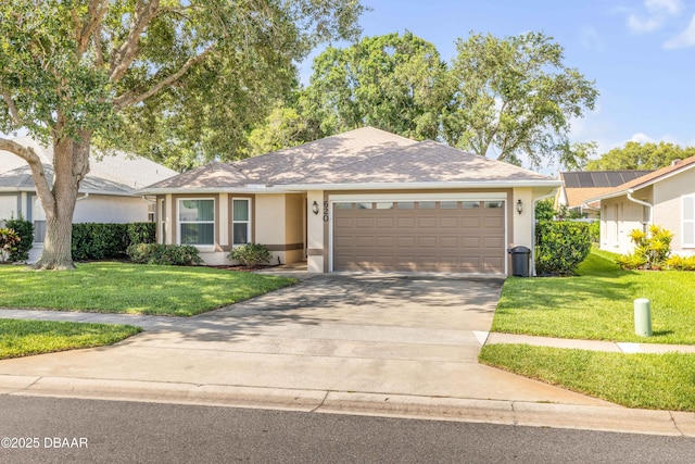 620 Middlebury Loop, New Smyrna Beach, FL 32168 - single story home with stucco siding, a garage, a front yard, and driveway