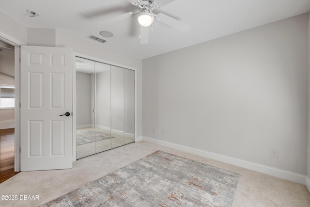 620 Middlebury Loop, New Smyrna Beach, FL 32168 - unfurnished bedroom featuring carpet flooring, a closet, and ceiling fan