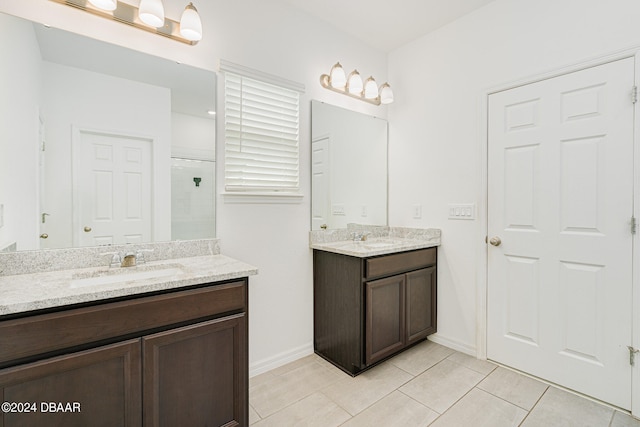 bathroom with vanity, tile patterned flooring, and a shower with shower door