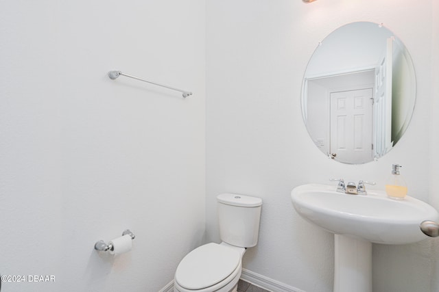 bathroom with toilet and sink