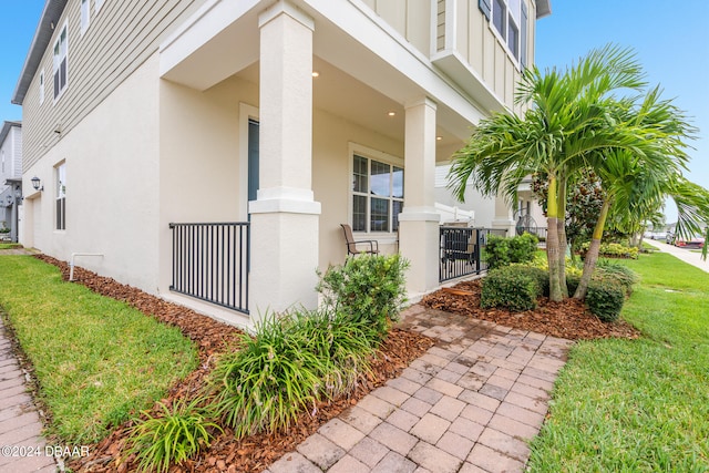 view of side of property with a lawn