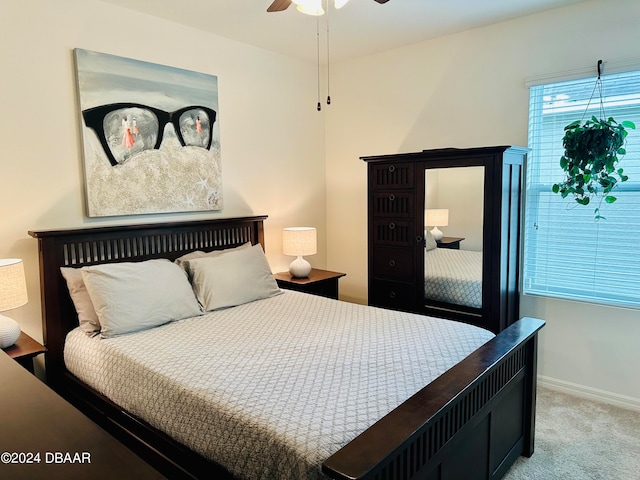 carpeted bedroom featuring ceiling fan