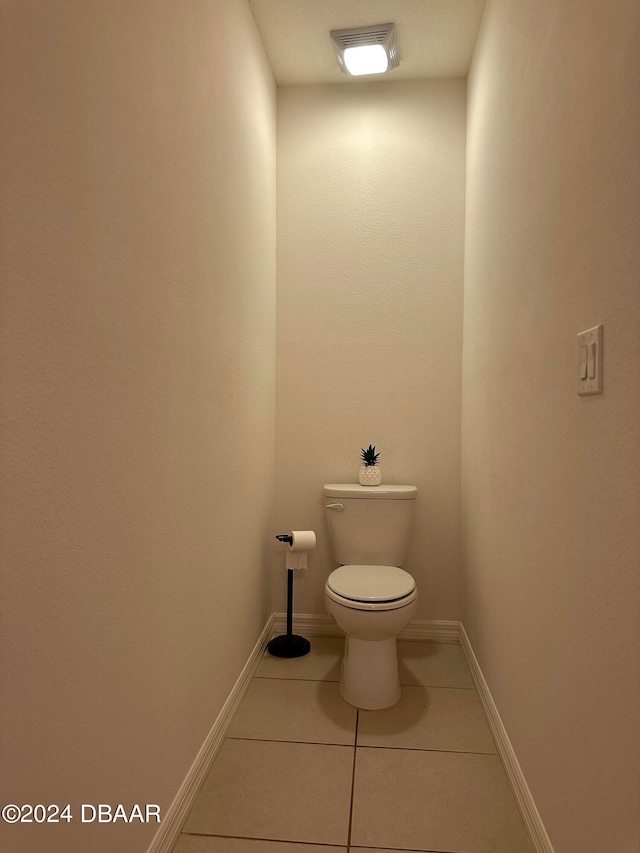 bathroom featuring tile patterned floors and toilet