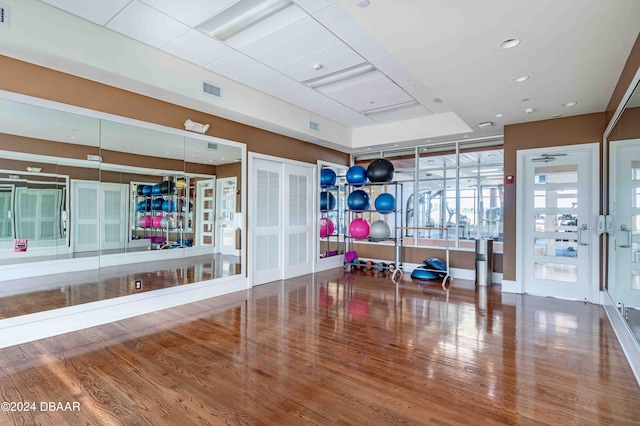 workout room with wood-type flooring