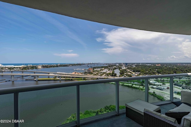 balcony featuring a water view