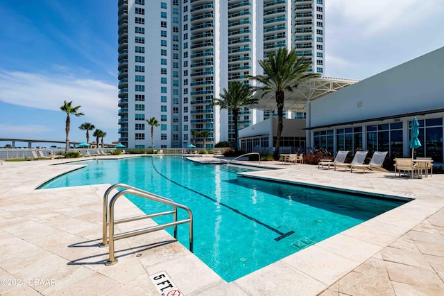 view of swimming pool featuring a patio