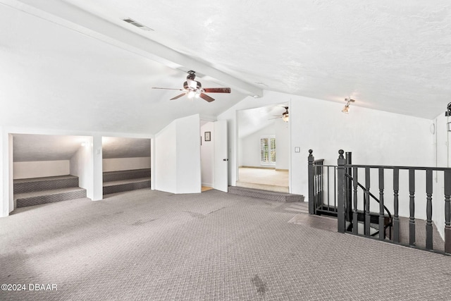 1127 Indigo Rd, Ormond Beach, FL 32174 - additional living space featuring carpet flooring, vaulted ceiling with beams, visible vents, and ceiling fan