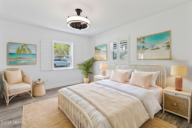 1127 Indigo Rd, Ormond Beach, FL 32174 - bedroom featuring baseboards and wood finished floors
