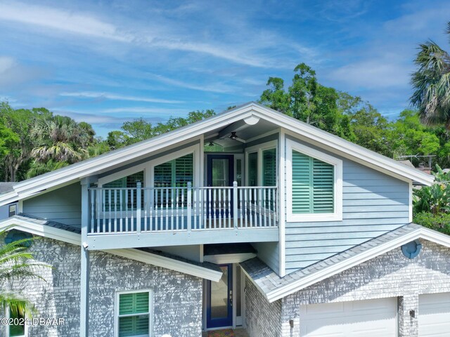 1127 Indigo Rd, Ormond Beach, FL 32174 - view of side of home featuring a balcony and a garage