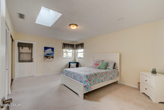 4766 S Atlantic Ave, Ponce Inlet, FL 32127 - bedroom featuring light colored carpet, a skylight, and baseboards
