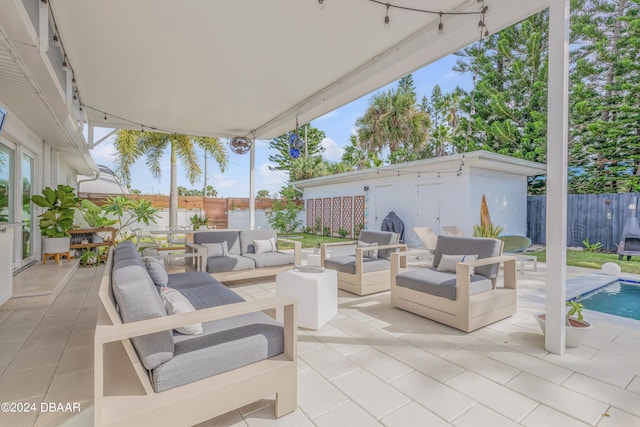 view of patio / terrace featuring outdoor lounge area and a fenced in pool