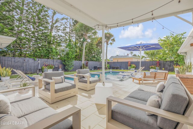 view of patio featuring a fenced in pool and an outdoor hangout area