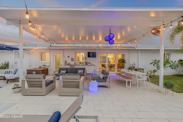 patio terrace at dusk with outdoor lounge area