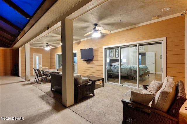 view of patio with outdoor lounge area and ceiling fan