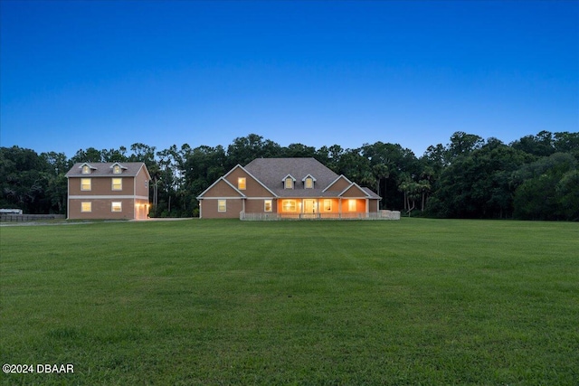 view of front of house with a yard