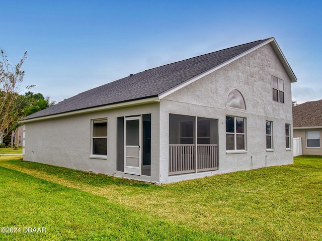 5336 Georgia Peach Ave, Port Orange, FL 32128 - rear view of property featuring a yard, stucco siding, and a shingled roof