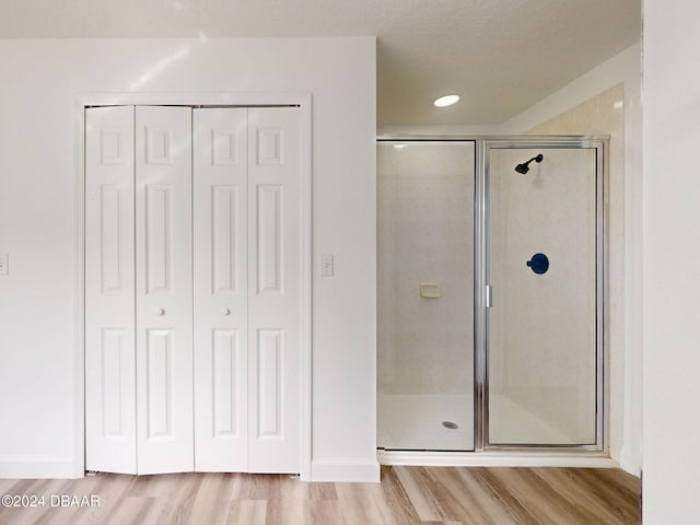 5336 Georgia Peach Ave, Port Orange, FL 32128 - full bath with wood finished floors, a stall shower, a closet, and recessed lighting