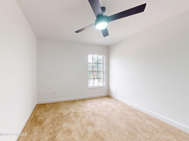 5336 Georgia Peach Ave, Port Orange, FL 32128 - unfurnished room with light carpet, baseboards, and ceiling fan