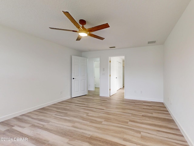 5336 Georgia Peach Ave, Port Orange, FL 32128 - unfurnished bedroom featuring light wood-type flooring, baseboards, and ceiling fan