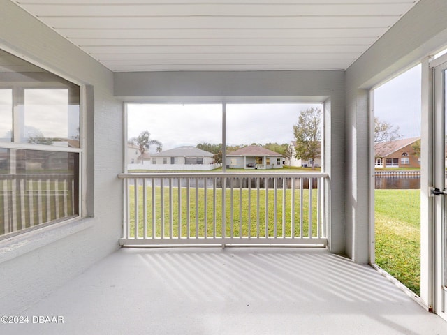 5336 Georgia Peach Ave, Port Orange, FL 32128 - unfurnished sunroom featuring plenty of natural light, a residential view, and a water view