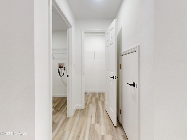 5336 Georgia Peach Ave, Port Orange, FL 32128 - hallway featuring light wood-style floors