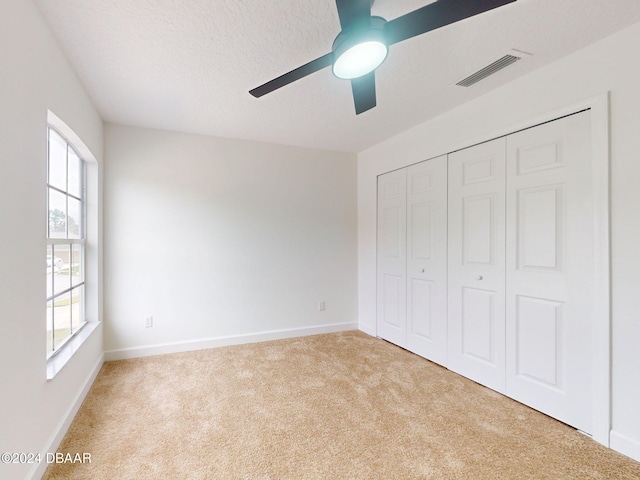 5336 Georgia Peach Ave, Port Orange, FL 32128 - unfurnished bedroom featuring carpet flooring, baseboards, and a closet