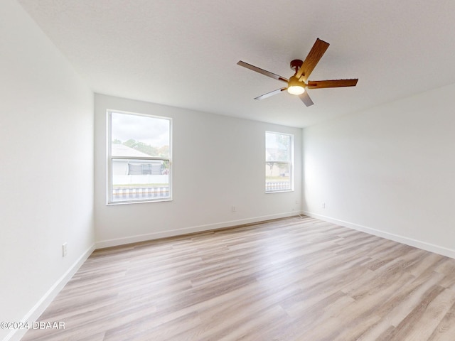 5336 Georgia Peach Ave, Port Orange, FL 32128 - spare room with a ceiling fan, light wood-type flooring, and baseboards