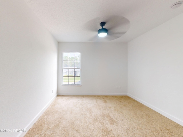 5336 Georgia Peach Ave, Port Orange, FL 32128 - spare room with light colored carpet, baseboards, a smoke detector, and ceiling fan