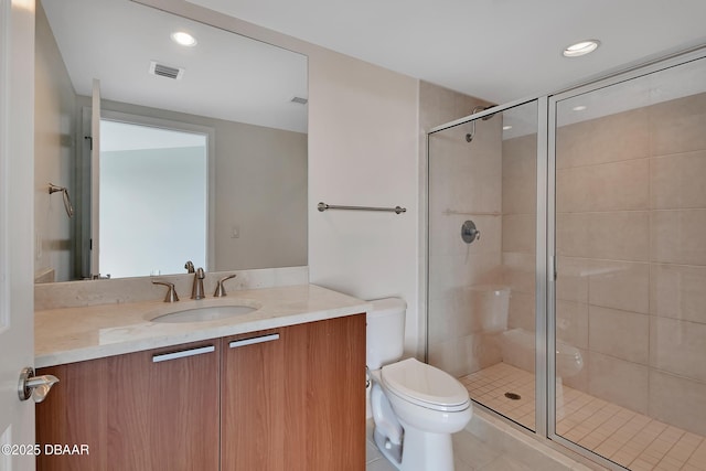 231 Riverside Dr Unit 1801, Daytona Beach, FL 32117 - bathroom with visible vents, toilet, vanity, a shower stall, and recessed lighting