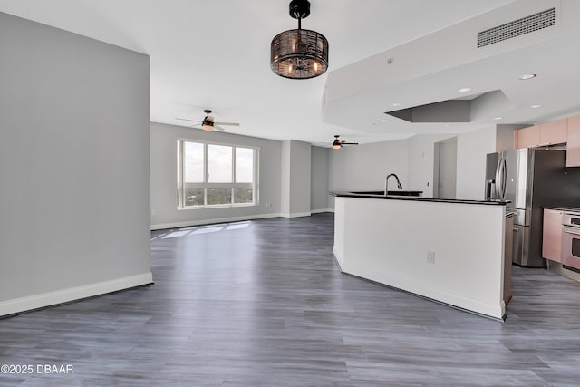 231 Riverside Dr Unit 1801, Daytona Beach, FL 32117 - kitchen with dark countertops, visible vents, appliances with stainless steel finishes, open floor plan, and baseboards