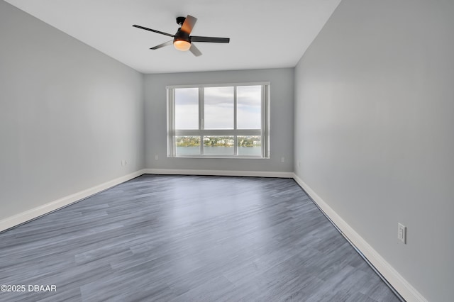 231 Riverside Dr Unit 1801, Daytona Beach, FL 32117 - unfurnished room featuring wood finished floors, a ceiling fan, and baseboards