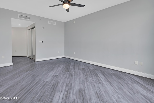 231 Riverside Dr Unit 1801, Daytona Beach, FL 32117 - empty room with wood finished floors, visible vents, and baseboards