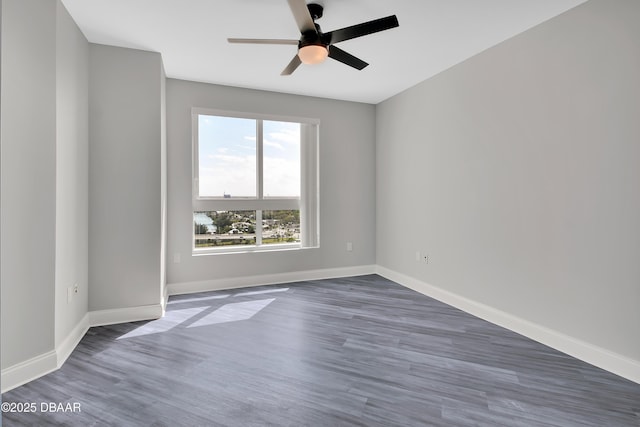 231 Riverside Dr Unit 1801, Daytona Beach, FL 32117 - spare room with ceiling fan, baseboards, and dark wood finished floors