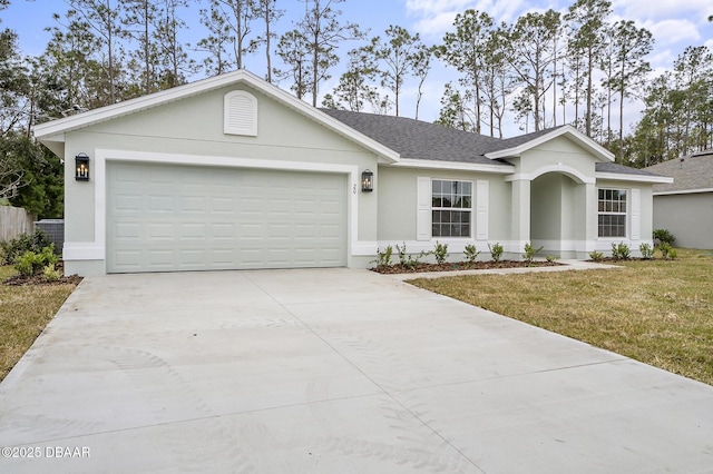 ranch-style house featuring a garage and a front lawn