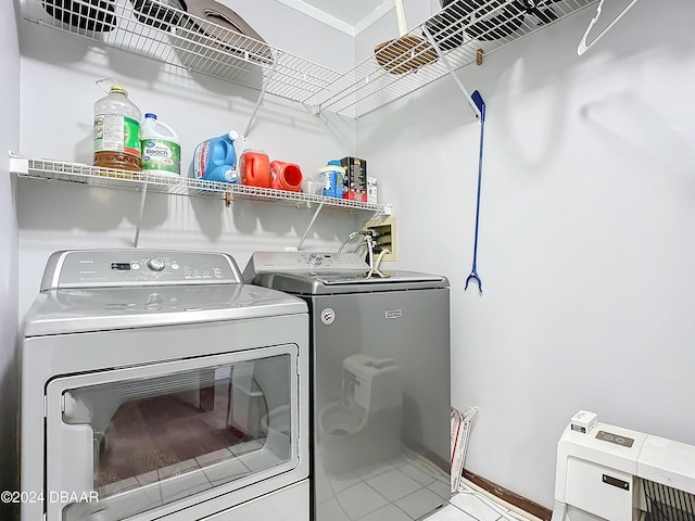 clothes washing area featuring independent washer and dryer