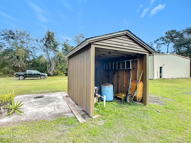 view of outdoor structure with a lawn