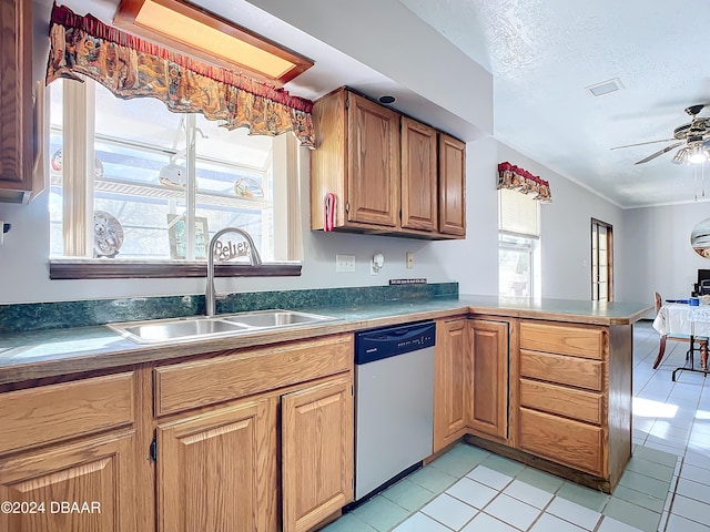 kitchen with dishwasher, light tile patterned flooring, sink, and ceiling fan