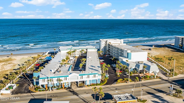 birds eye view of property featuring a water view and a view of the beach