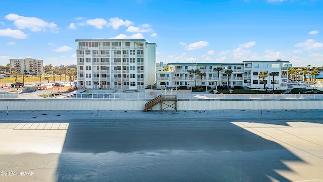 view of swimming pool featuring a water view