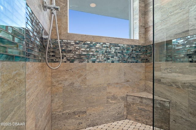 bathroom featuring tiled shower