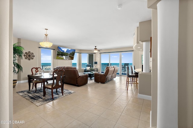 tiled living room featuring ceiling fan