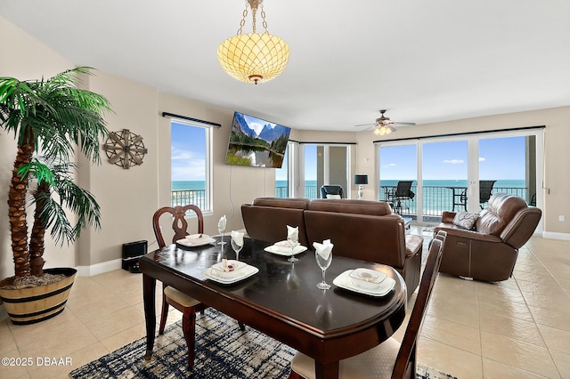 tiled dining room with ceiling fan