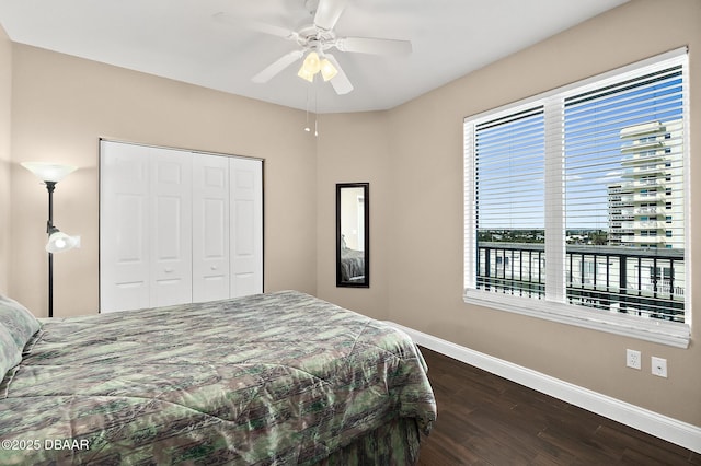 bedroom featuring a closet, ceiling fan, and dark hardwood / wood-style floors