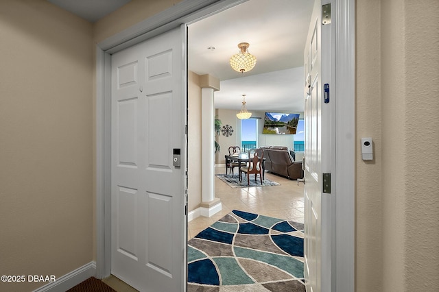 entryway with light tile patterned floors