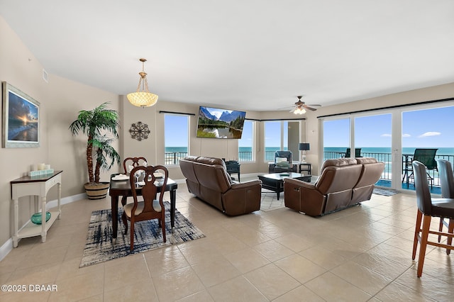 tiled living room with ceiling fan