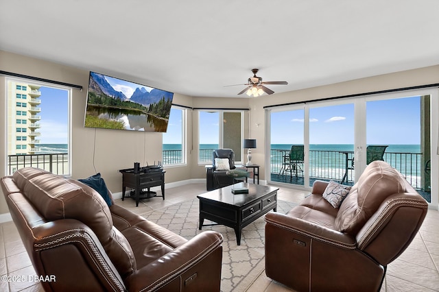 living room with light tile patterned flooring and ceiling fan